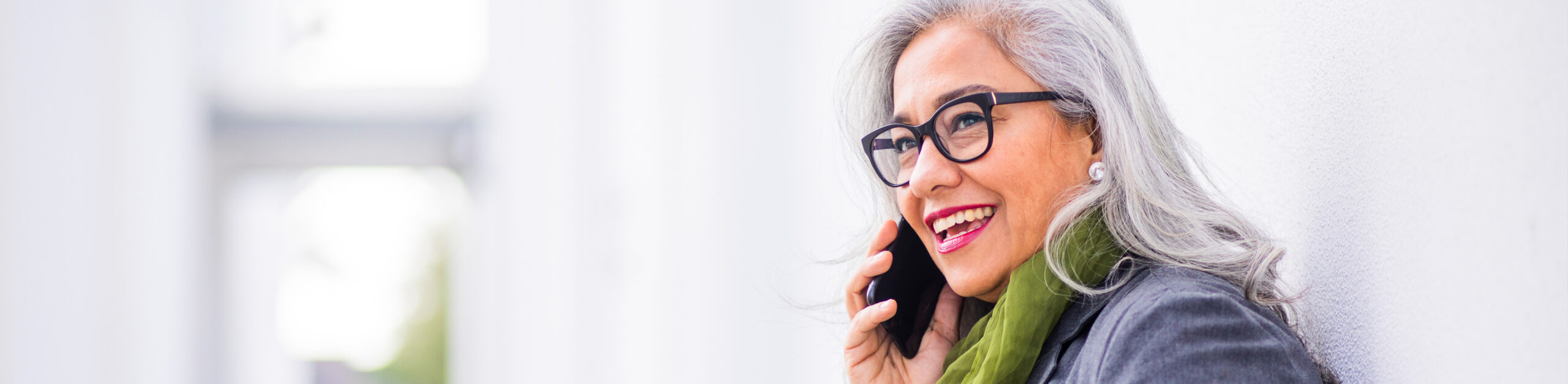 Smiling senior woman with a caregiver, symbolizing compassionate care