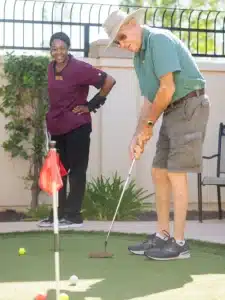 ActivCare Resident having a great time playing golf.