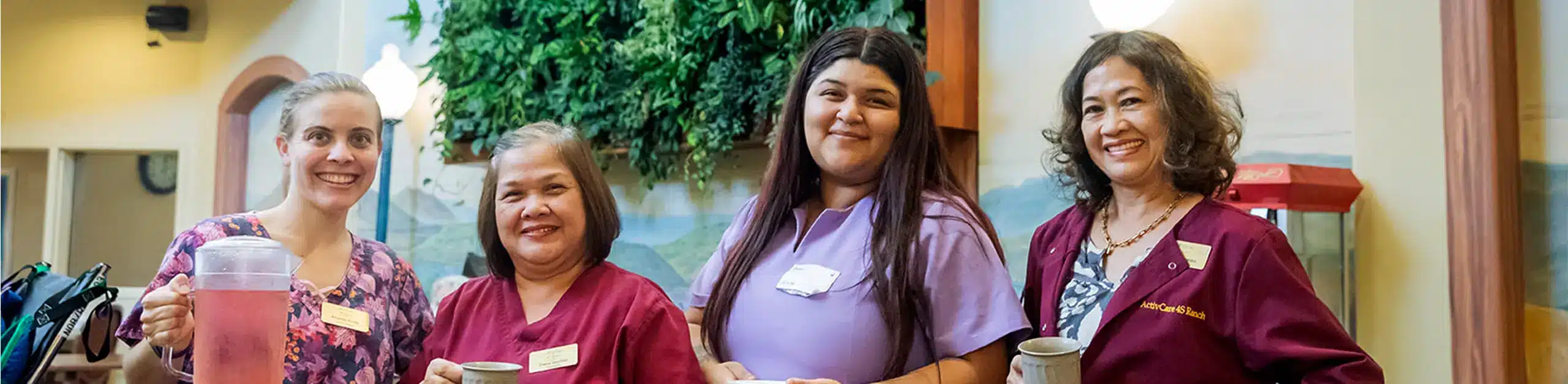 A team of smiling caregivers at ActivCare.