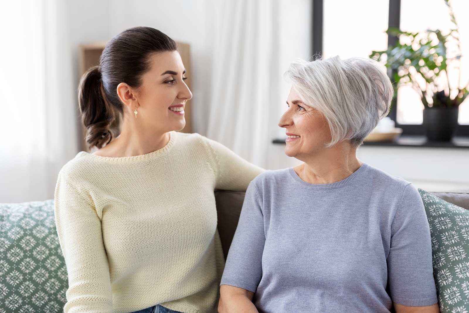 Mother and daughter in compassionate conversation due to dementia and memory loss concerns